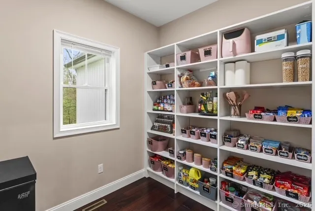 a kitchen with stainless steel appliances a refrigerator and a stove top oven