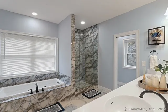 a bathroom with a sink double vanity and a mirror