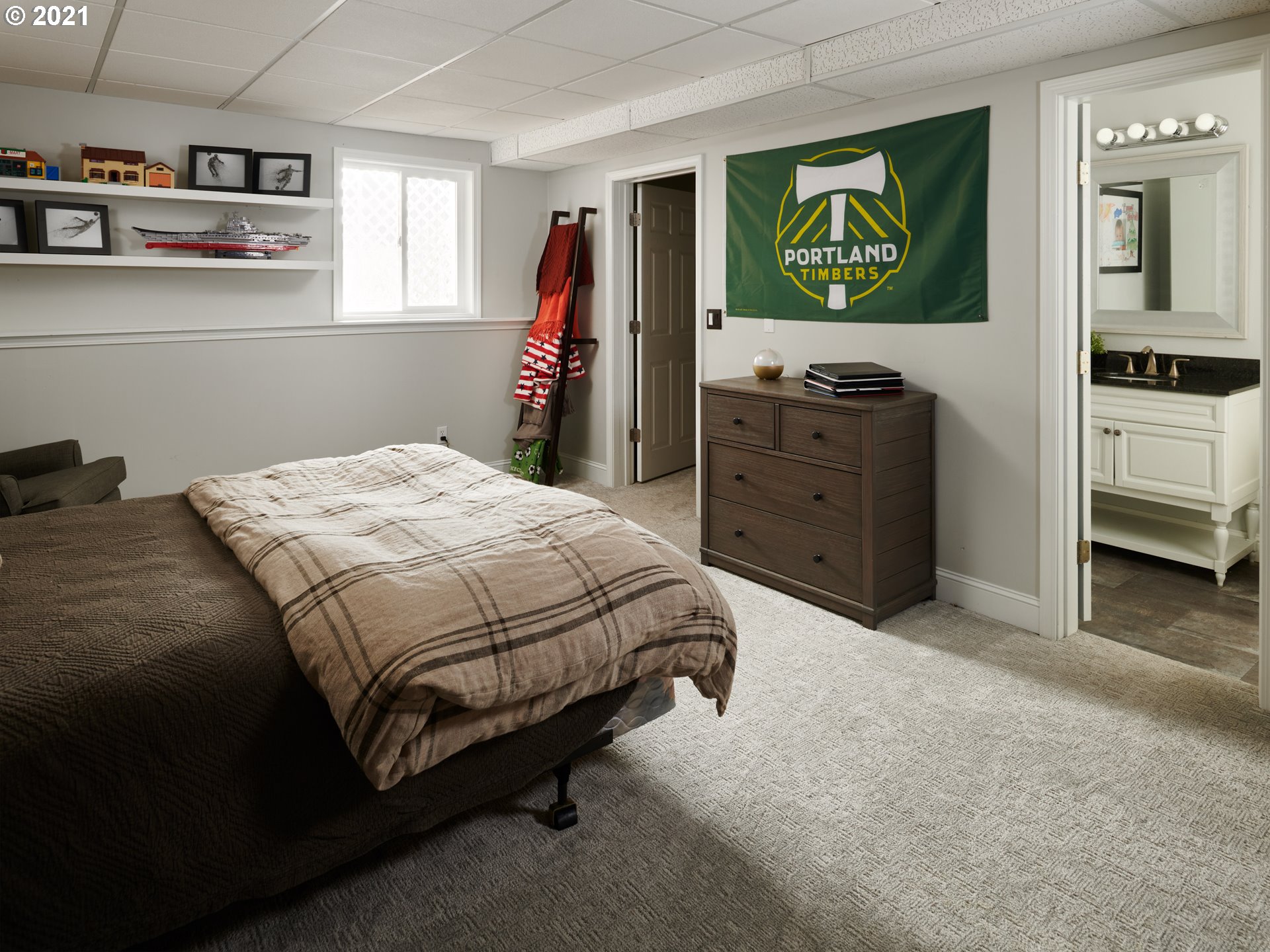 24355 Southwest Melott Road Hillsboro, OR 97123 - Photo 21 of 32 a bedroom with a bed and a window