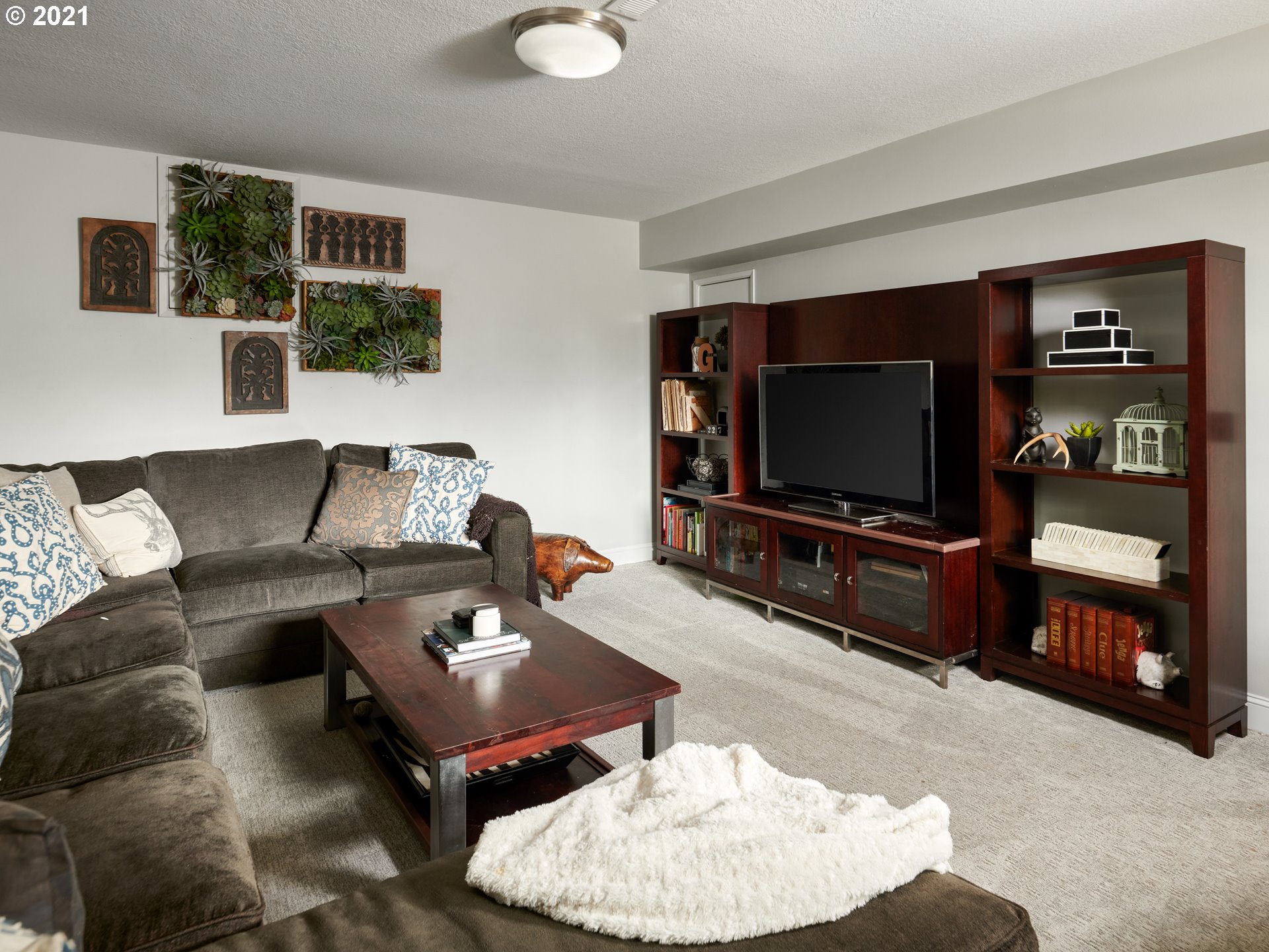 24355 Southwest Melott Road Hillsboro, OR 97123 - Photo 24 of 32 a living room with furniture and a flat screen tv
