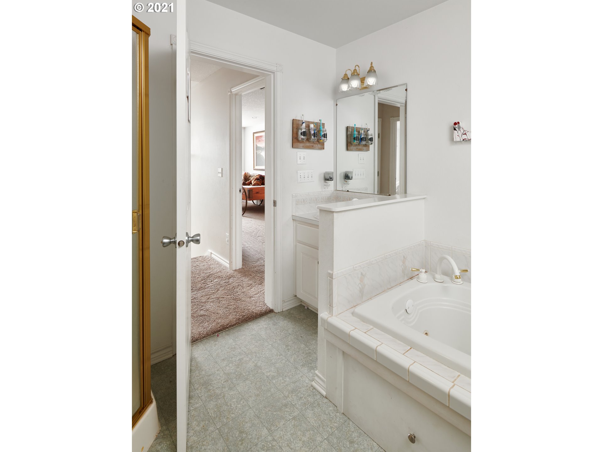 24355 Southwest Melott Road Hillsboro, OR 97123 - Photo 27 of 32 a bathroom with a tub sink and mirror