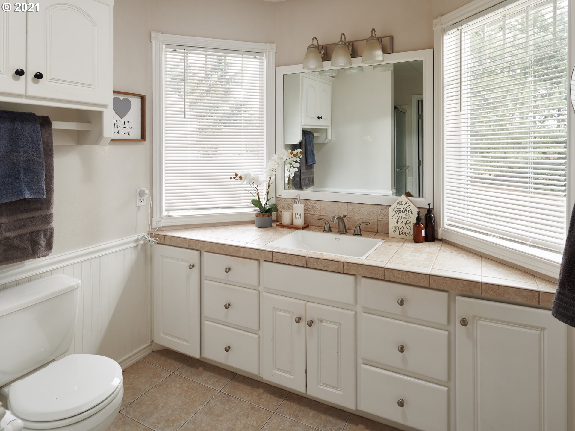 24355 Southwest Melott Road Hillsboro, OR 97123 - Photo 28 of 32 a bathroom with a granite countertop sink mirror vanity and toilet
