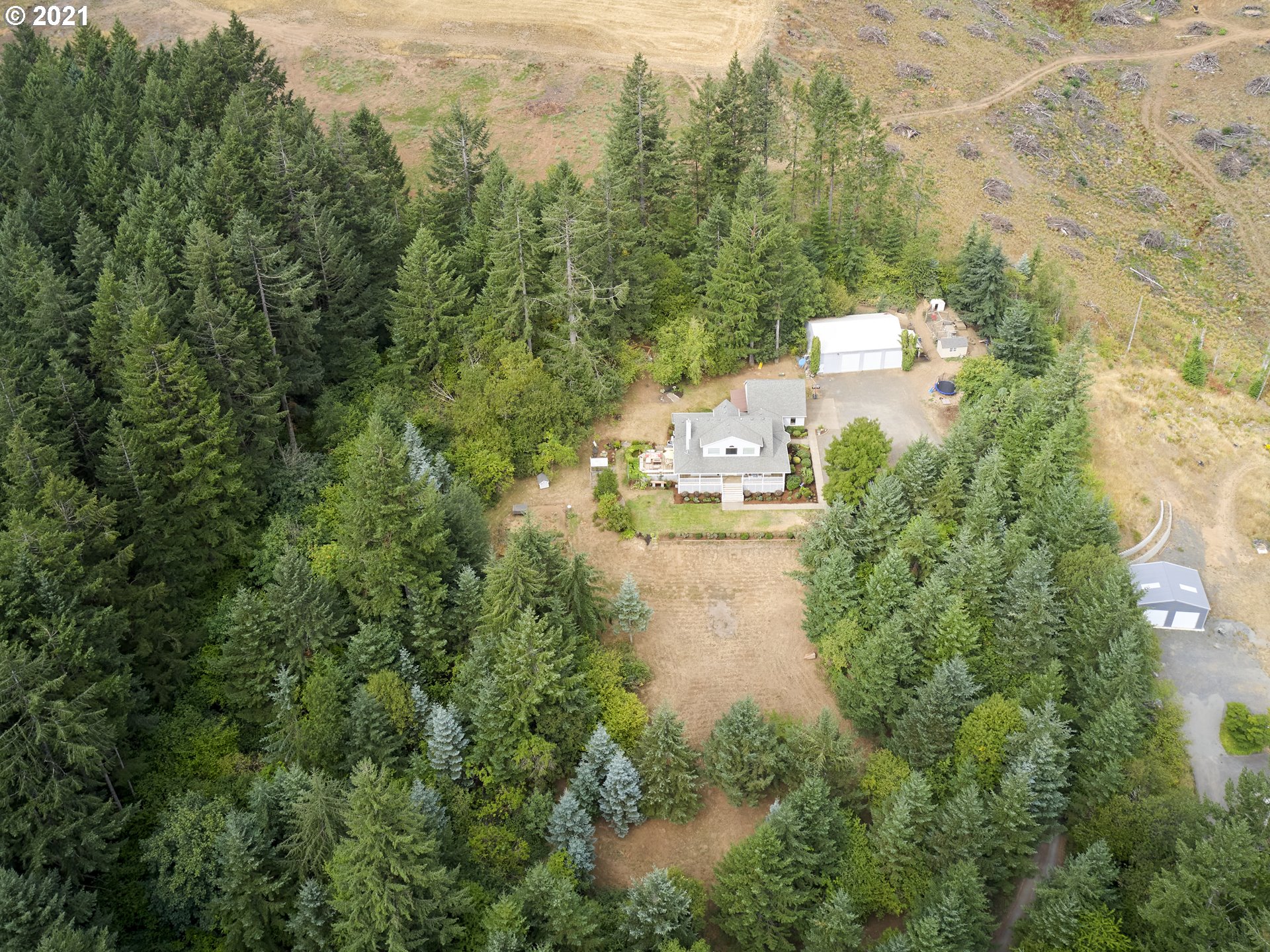 24355 Southwest Melott Road Hillsboro, OR 97123 - Photo 5 of 32 an aerial view of residential houses with outdoor space and trees