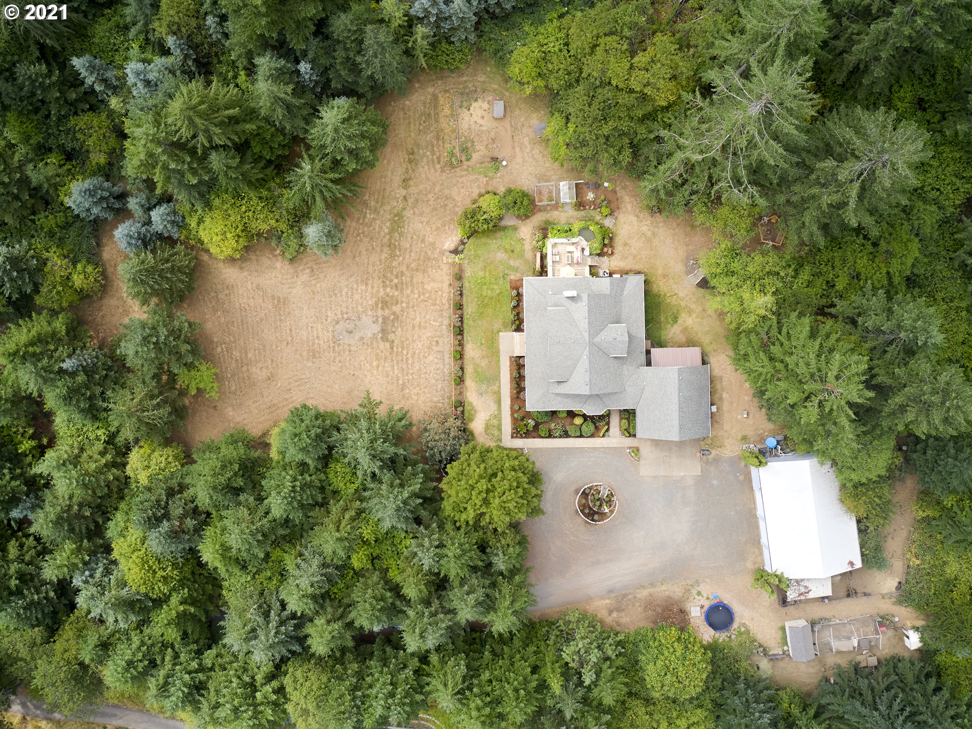 24355 Southwest Melott Road Hillsboro, OR 97123 - Photo 6 of 32 an aerial view of a house with outdoor space and trees all around