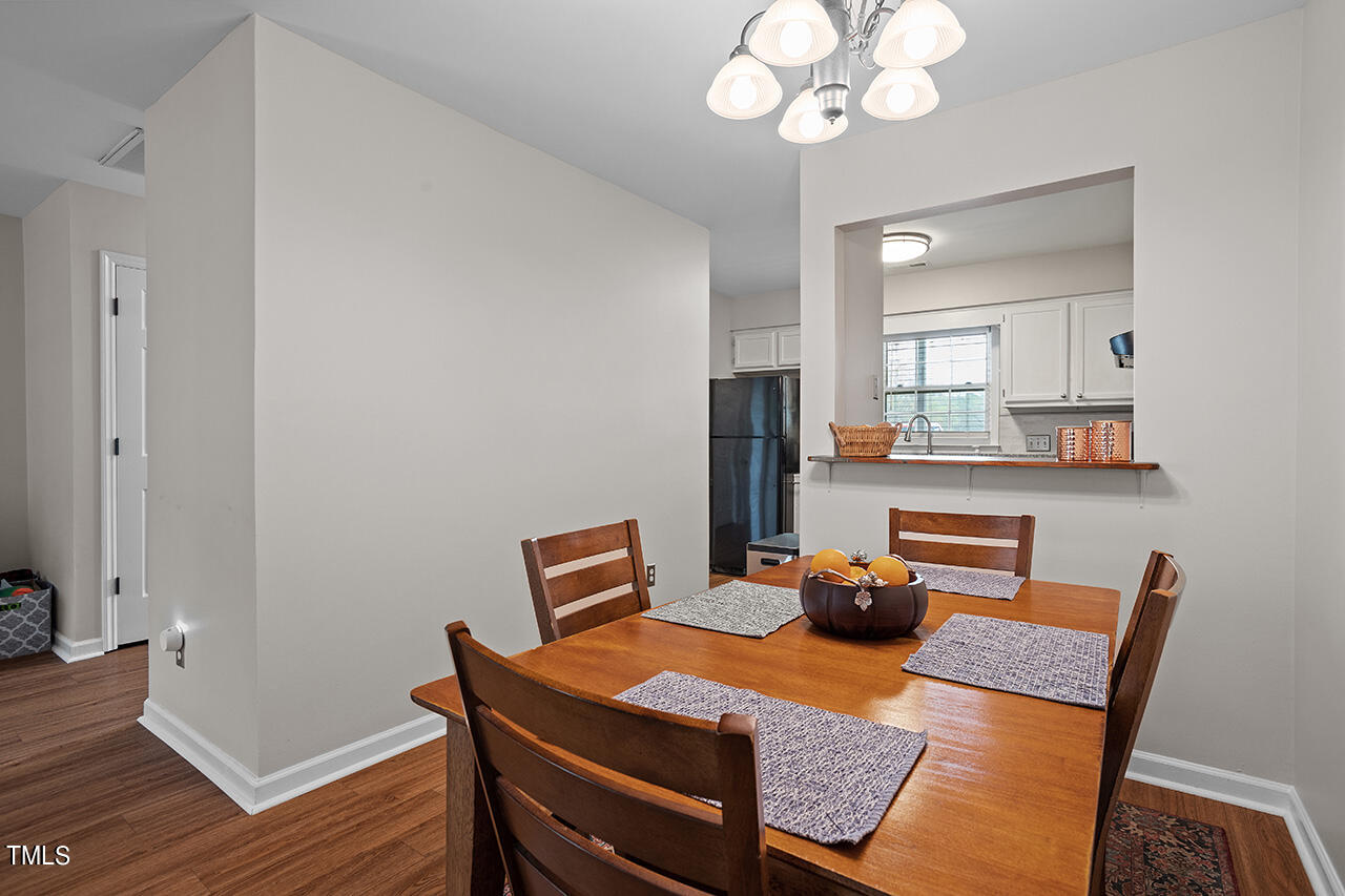 107 Long Shadow Place Durham, NC 27713 - Photo 13 of 31 a view of a dining room with furniture and wooden floor
