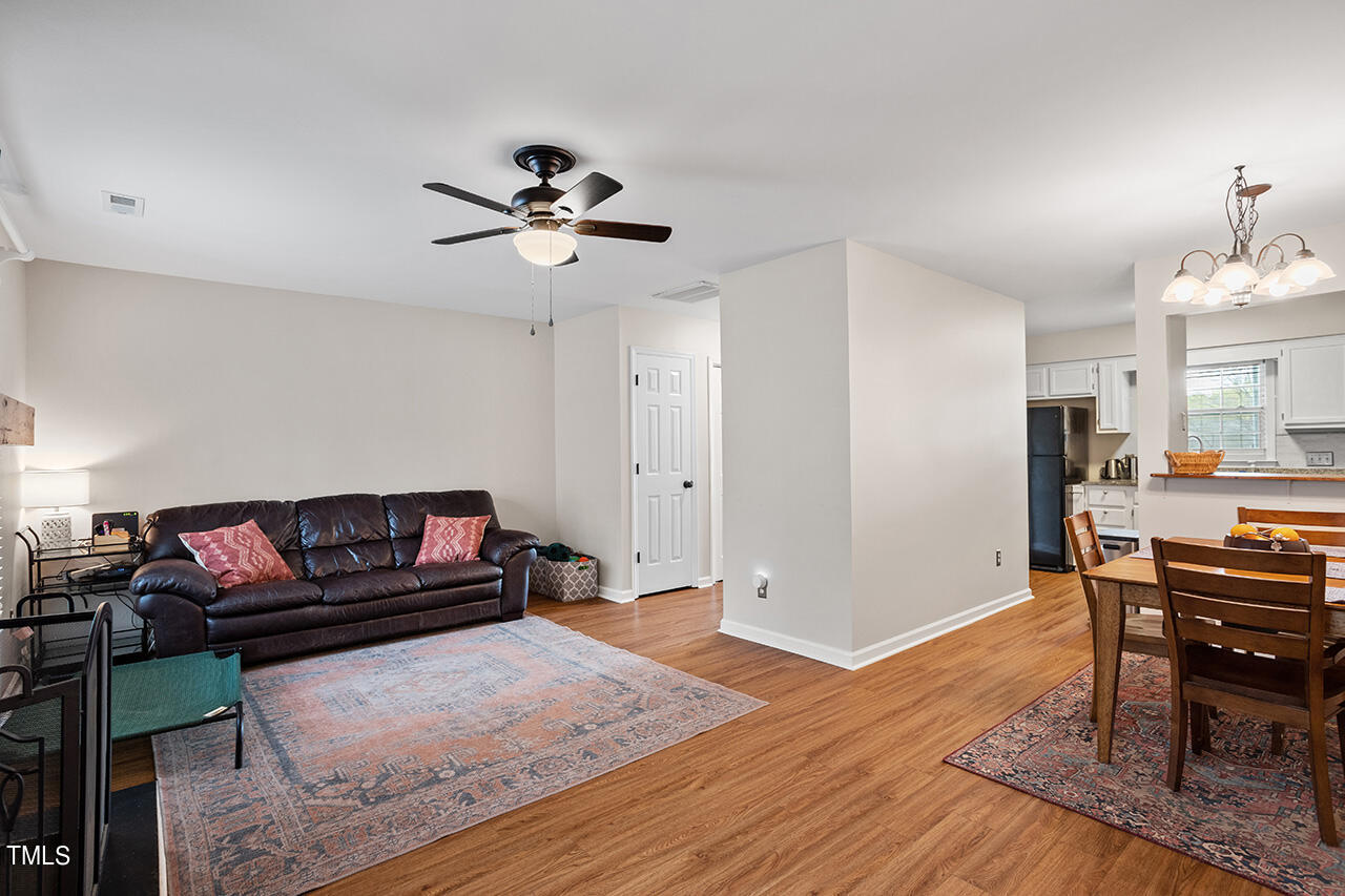 107 Long Shadow Place Durham, NC 27713 - Photo 15 of 31 a living room with furniture and a wooden floor