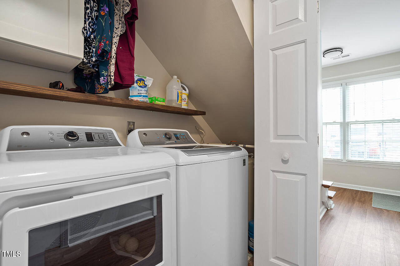 107 Long Shadow Place Durham, NC 27713 - Photo 19 of 31 a view of storage and utility room with washer and dryer