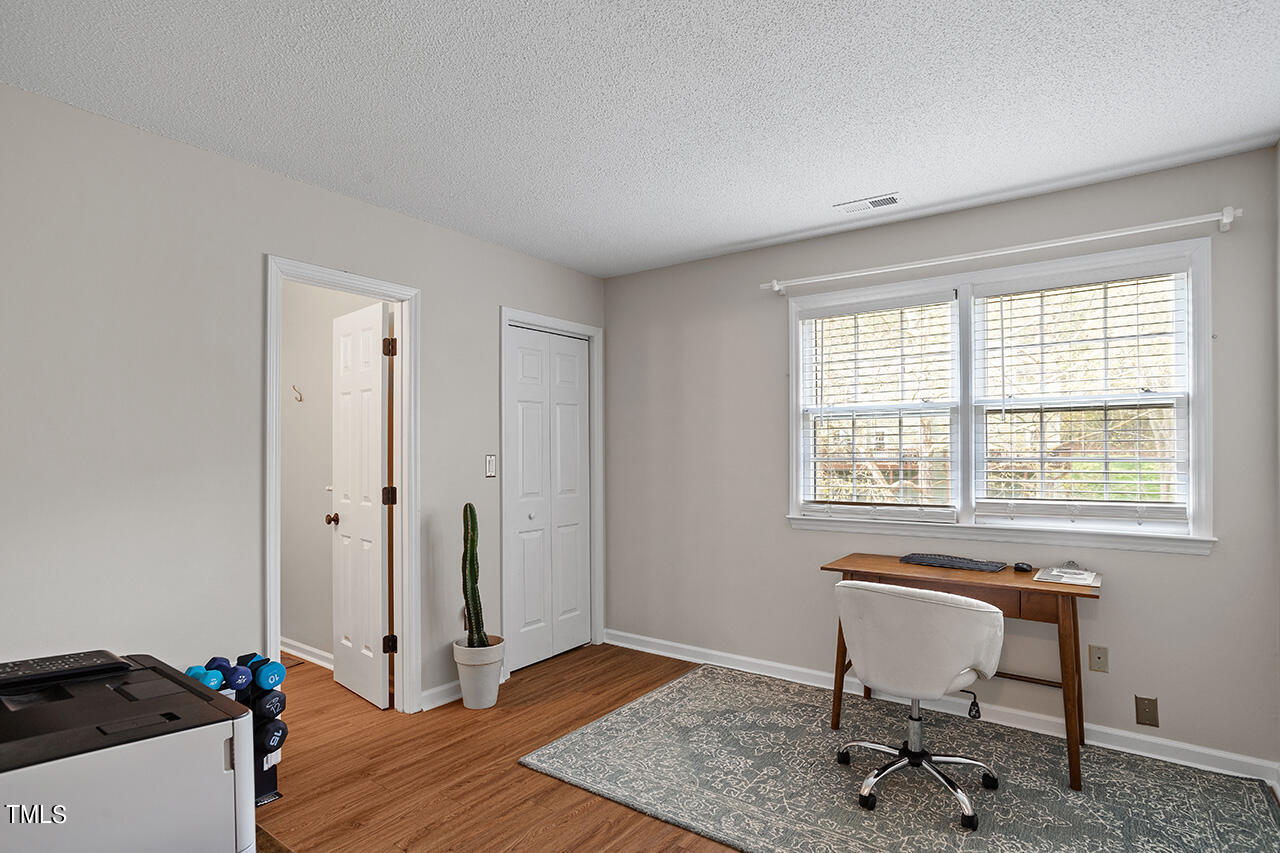 107 Long Shadow Place Durham, NC 27713 - Photo 20 of 31 a workspace with furniture and a window
