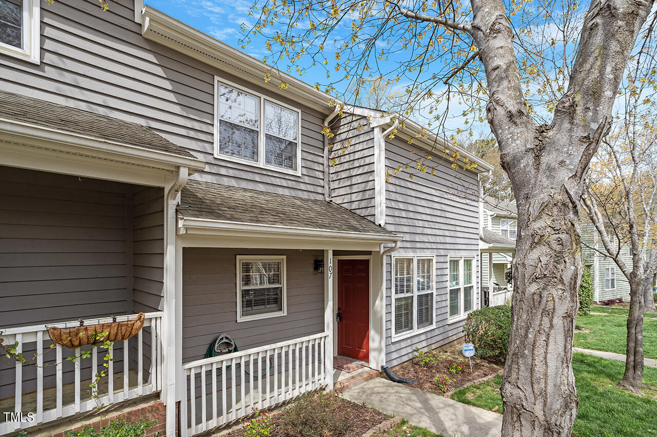 107 Long Shadow Place Durham, NC 27713 - Photo 2 of 31 a front view of a house with a tree