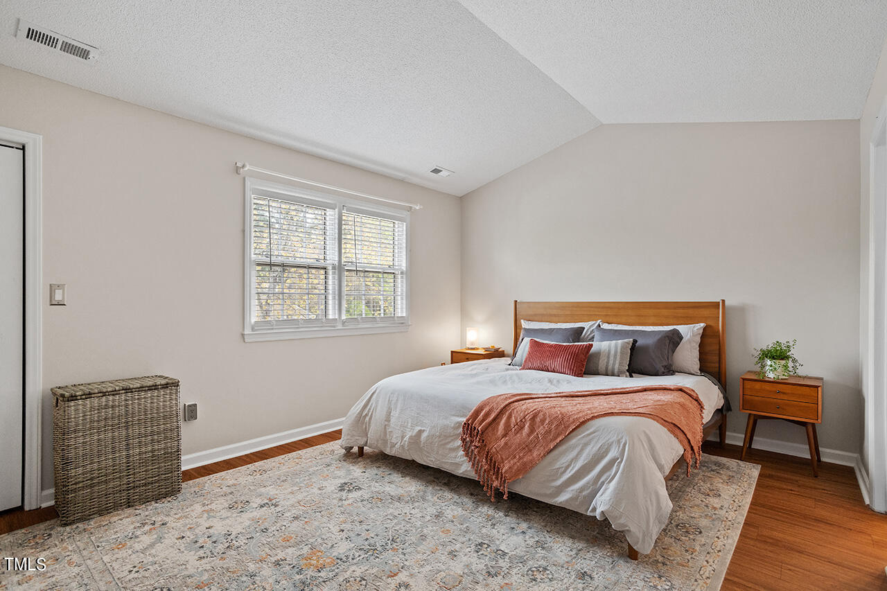 107 Long Shadow Place Durham, NC 27713 - Photo 23 of 31 a bedroom with a bed and a window