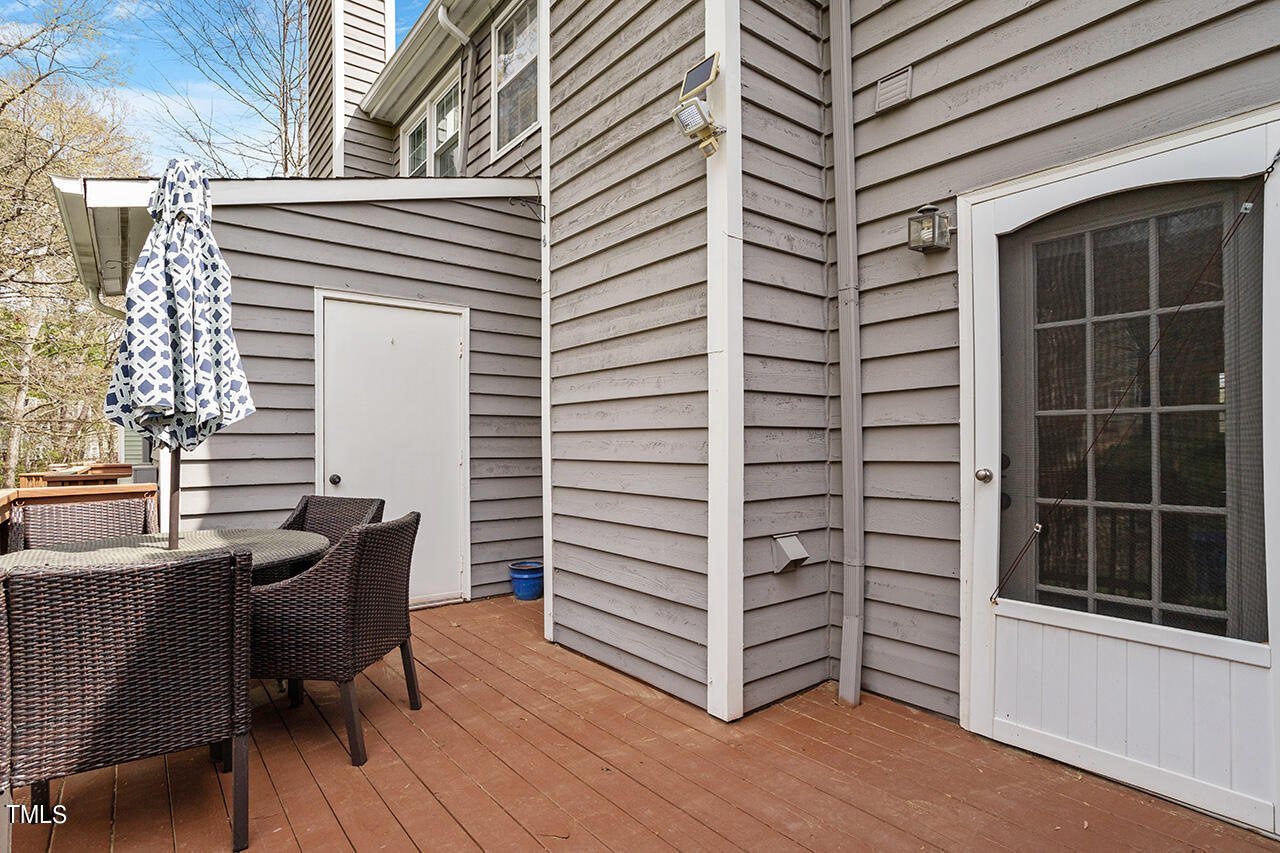 107 Long Shadow Place Durham, NC 27713 - Photo 26 of 31 a view of a balcony with furniture and wooden floor
