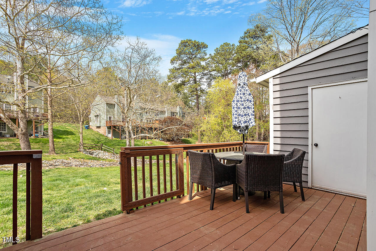 107 Long Shadow Place Durham, NC 27713 - Photo 30 of 31 a view of a deck with table and chairs and wooden floor