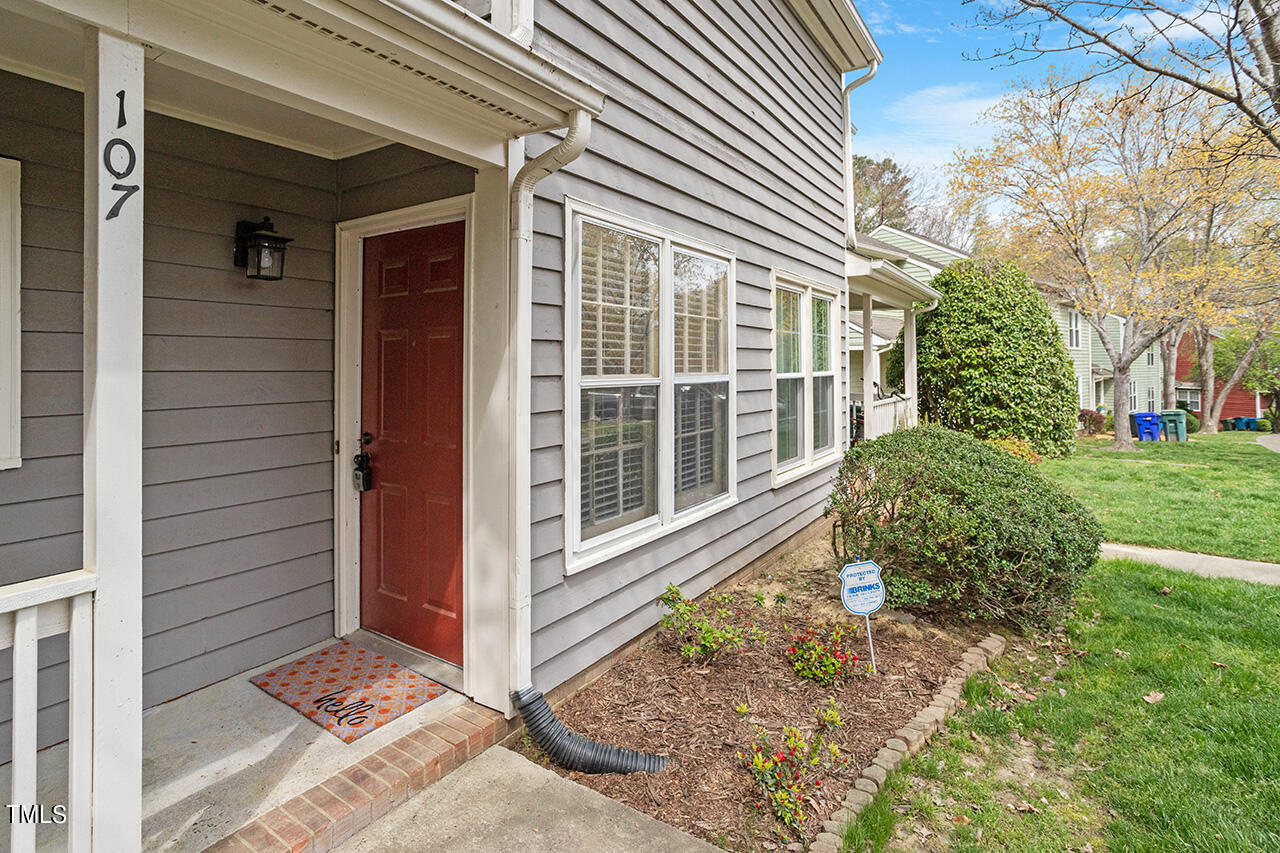 107 Long Shadow Place Durham, NC 27713 - Photo 5 of 31 a front view of a house with garden