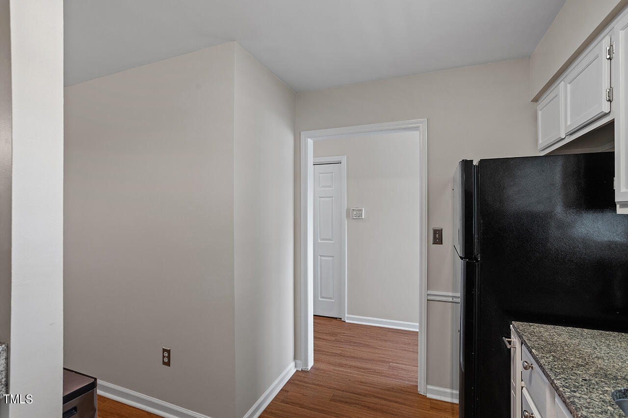107 Long Shadow Place Durham, NC 27713 - Photo 9 of 31 a view of a kitchen from the hallway