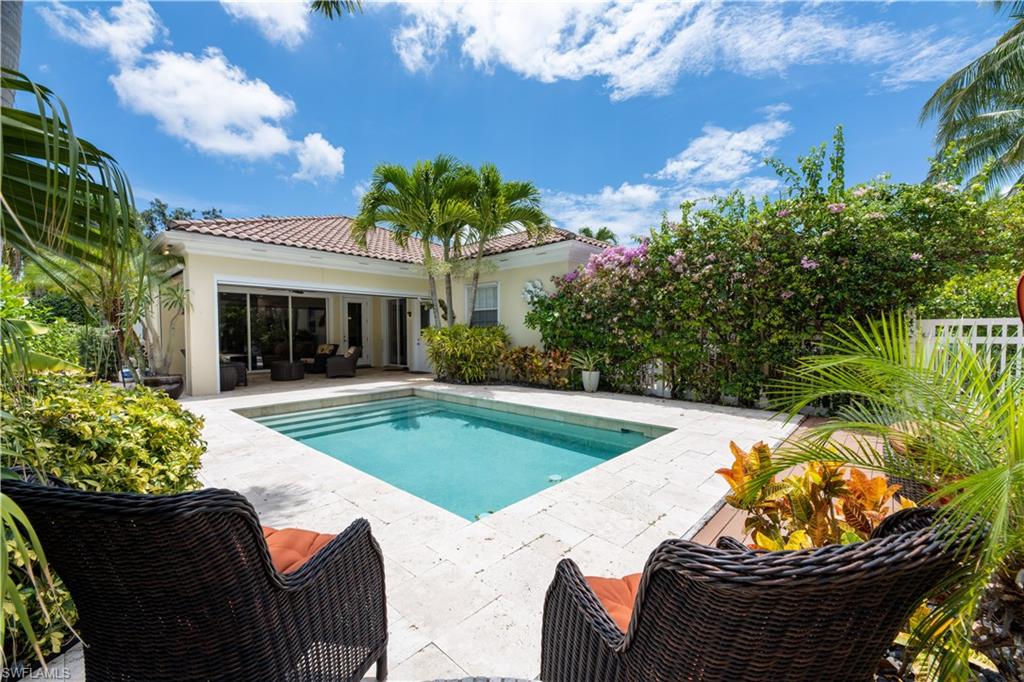 136 Florence Drive Jupiter, FL 33458 - Photo 3 of 23 a view of a swimming pool with a porch