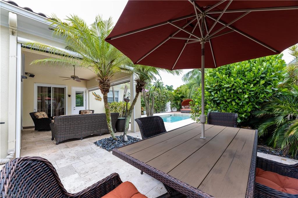 136 Florence Drive Jupiter, FL 33458 - Photo 4 of 23 a view of backyard with seating space and wooden floor