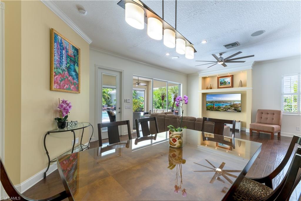 136 Florence Drive Jupiter, FL 33458 - Photo 7 of 23 a living room with furniture dining table and a large window