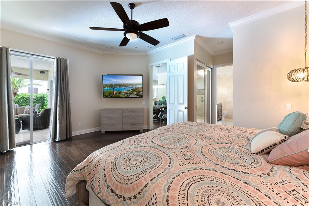 136 Florence Drive Jupiter, FL 33458 - Photo 8 of 23 a bedroom with a bed and a large window