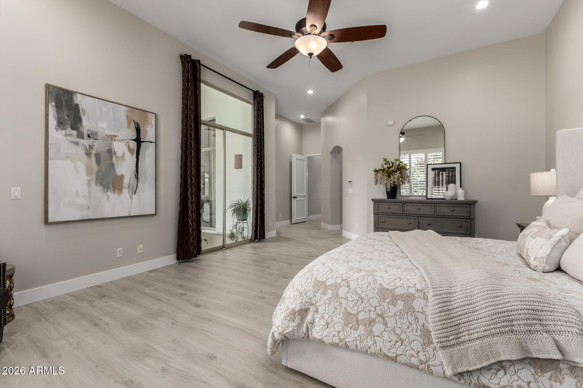 103 West Vista Avenue Phoenix, AZ 85021 - Photo 17 of 43 a bedroom with a large bed and a chandelier