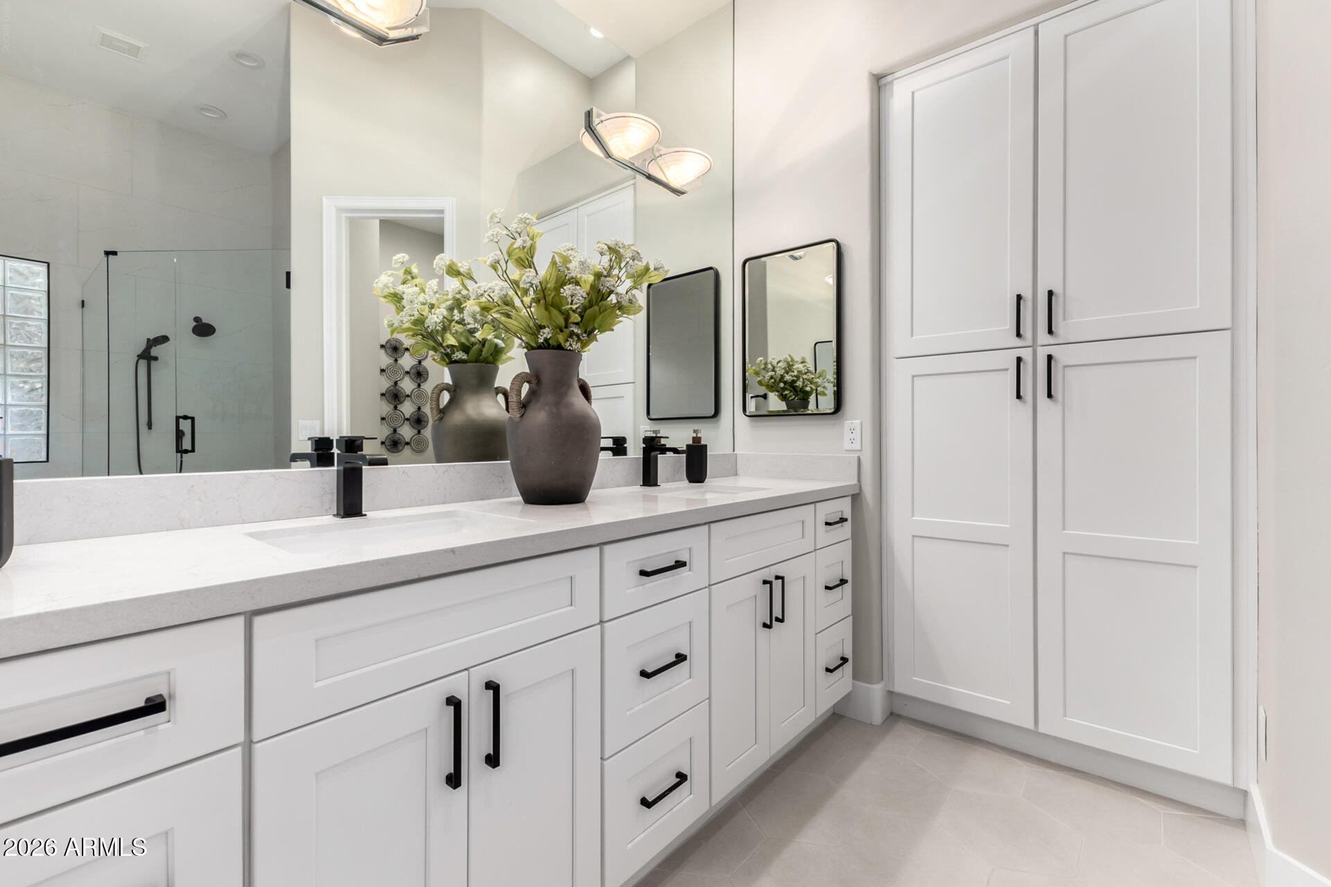103 West Vista Avenue Phoenix, AZ 85021 - Photo 20 of 43 a bathroom with a double vanity sink a mirror and shower