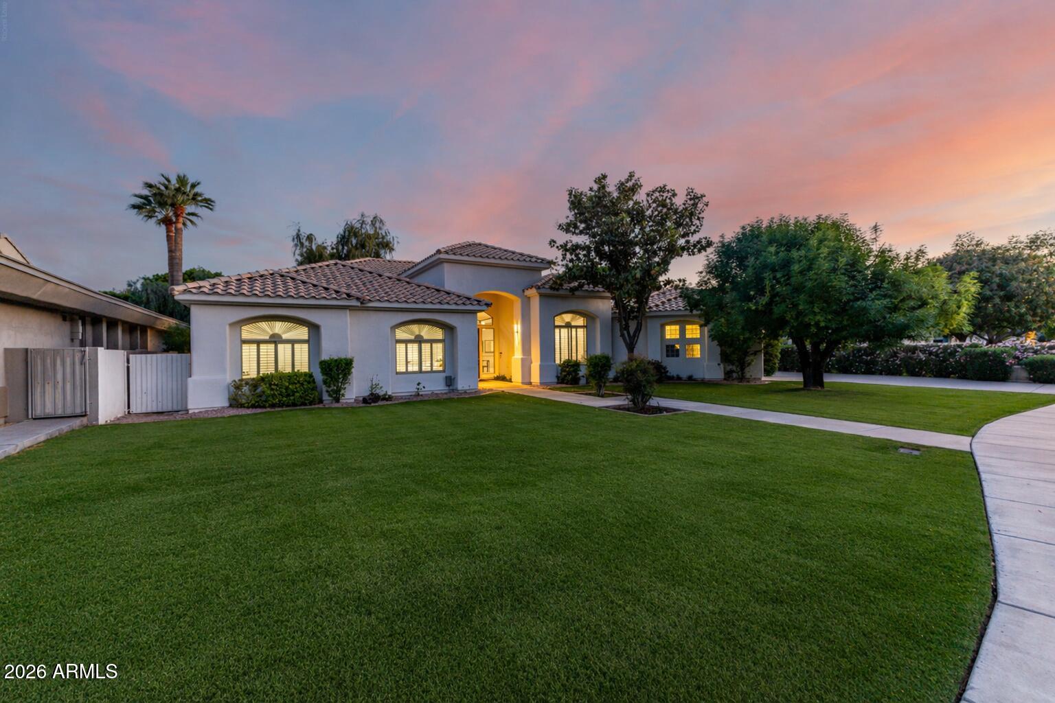 103 West Vista Avenue Phoenix, AZ 85021 - Photo 2 of 43 a view of a big house with a big yard and large trees