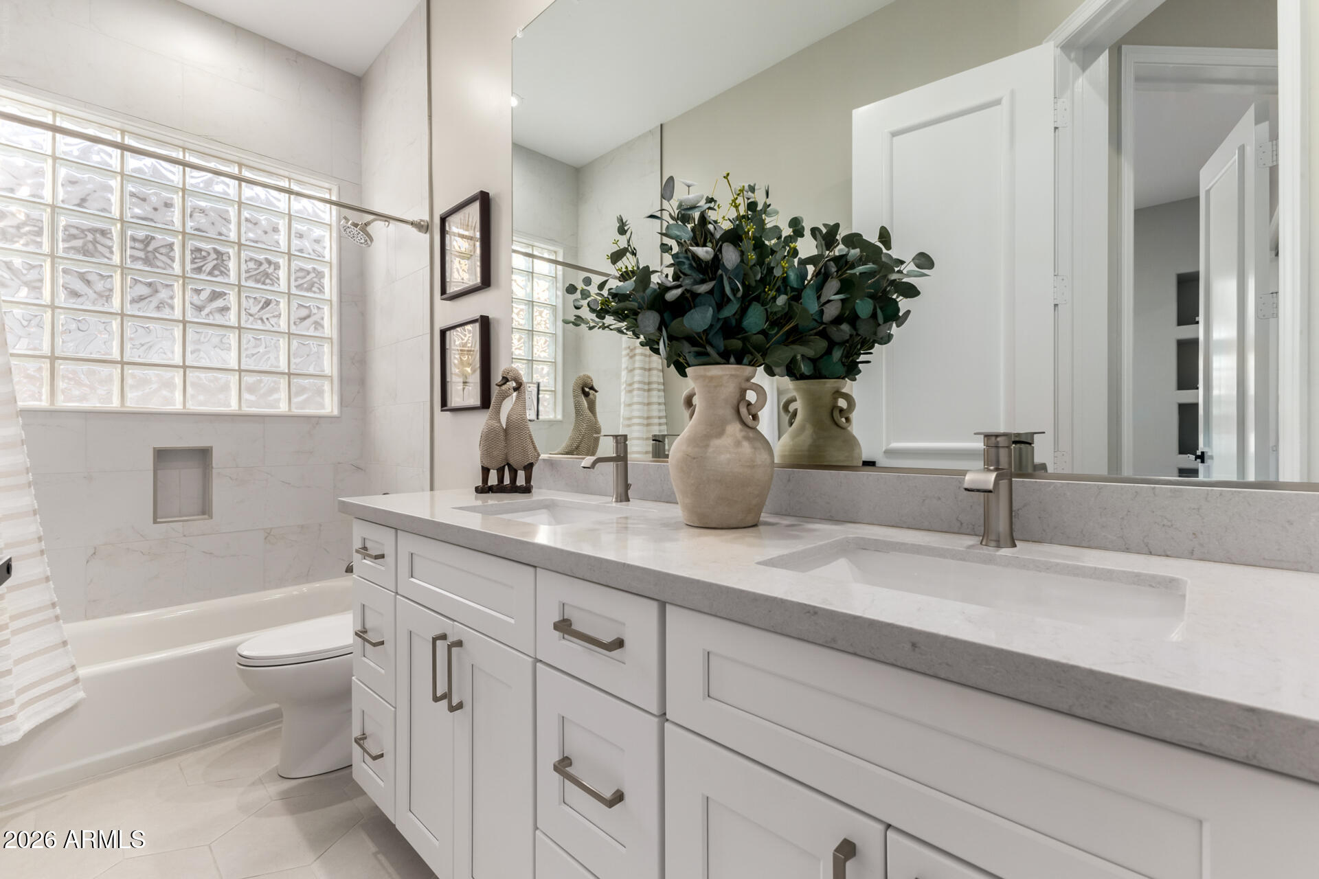 103 West Vista Avenue Phoenix, AZ 85021 - Photo 25 of 43 a bathroom with a double vanity sink toilet mirror and bathtub