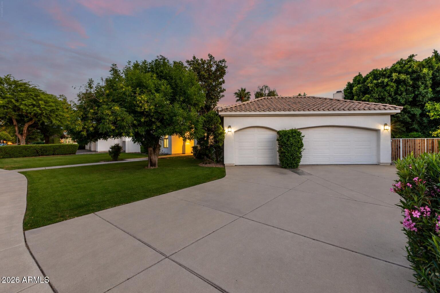 103 West Vista Avenue Phoenix, AZ 85021 - Photo 3 of 43 a view of a house with a yard and a garage