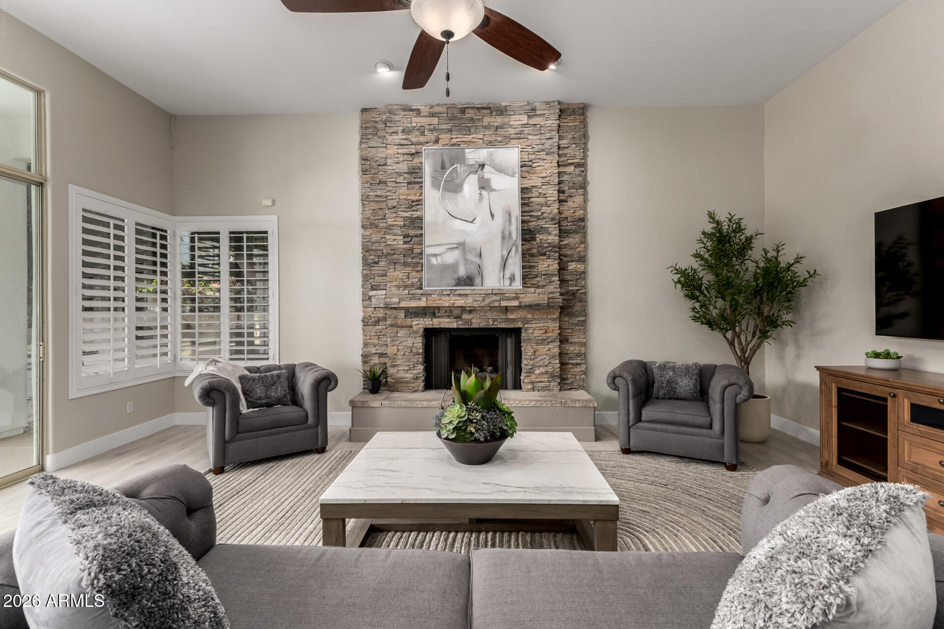 103 West Vista Avenue Phoenix, AZ 85021 - Photo 10 of 43 a living room with furniture a fireplace and a flat screen tv