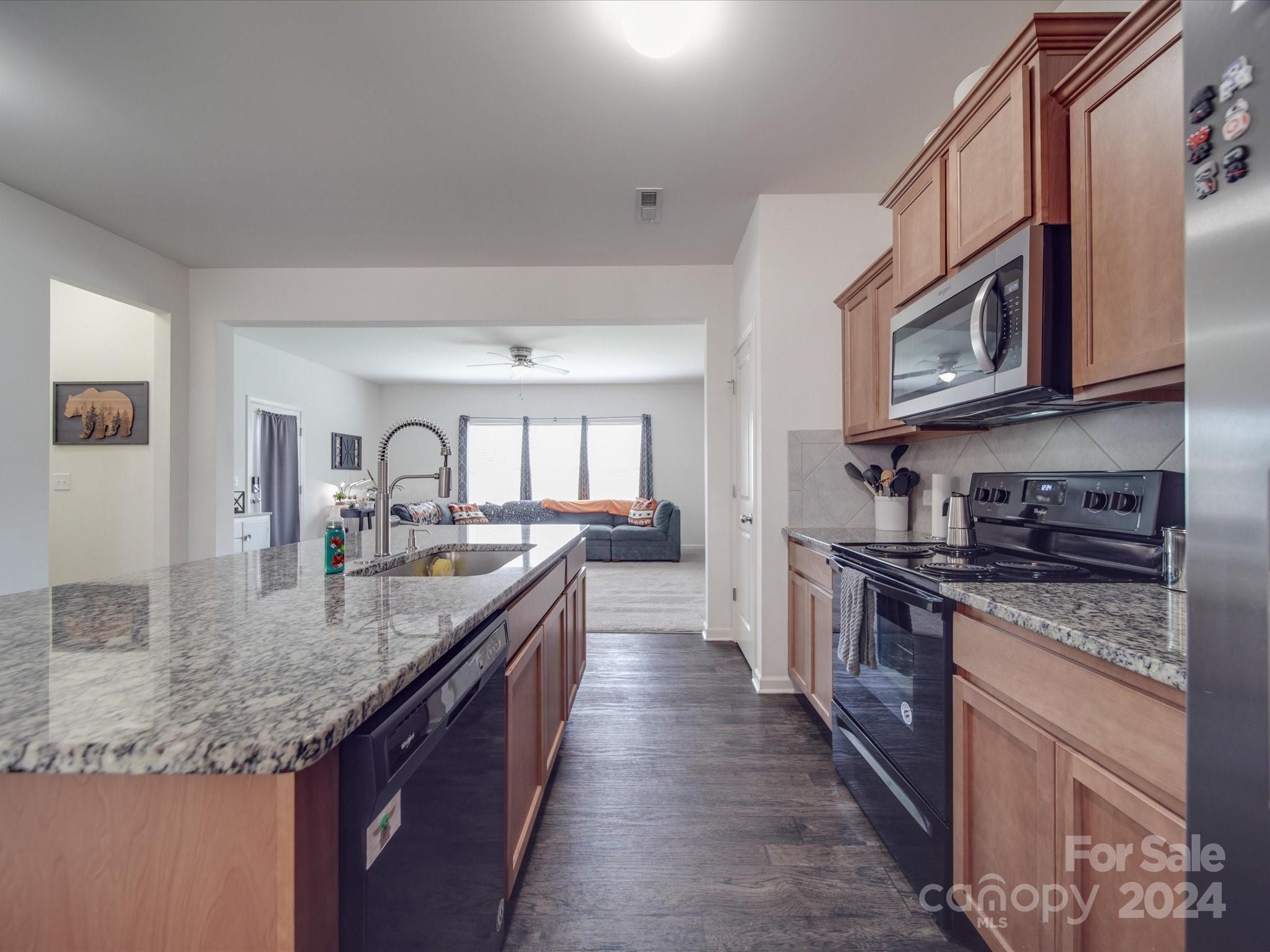3824 Tersk Drive Midland, NC 28107 - Photo 15 of 39 a large kitchen with granite countertop a lot of counter space and a sink