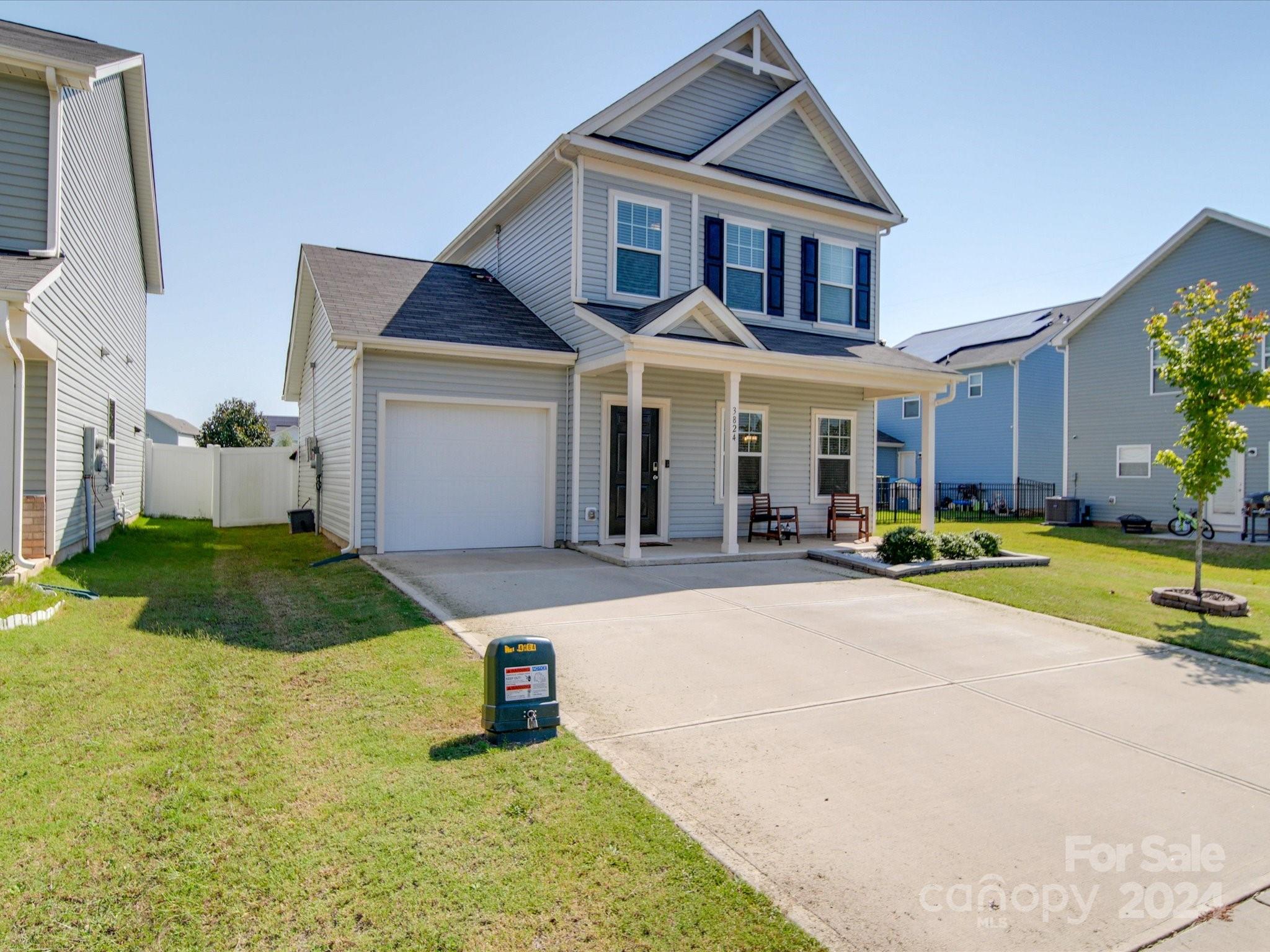 3824 Tersk Drive Midland, NC 28107 - Photo 2 of 39 a front view of a house with yard and green space