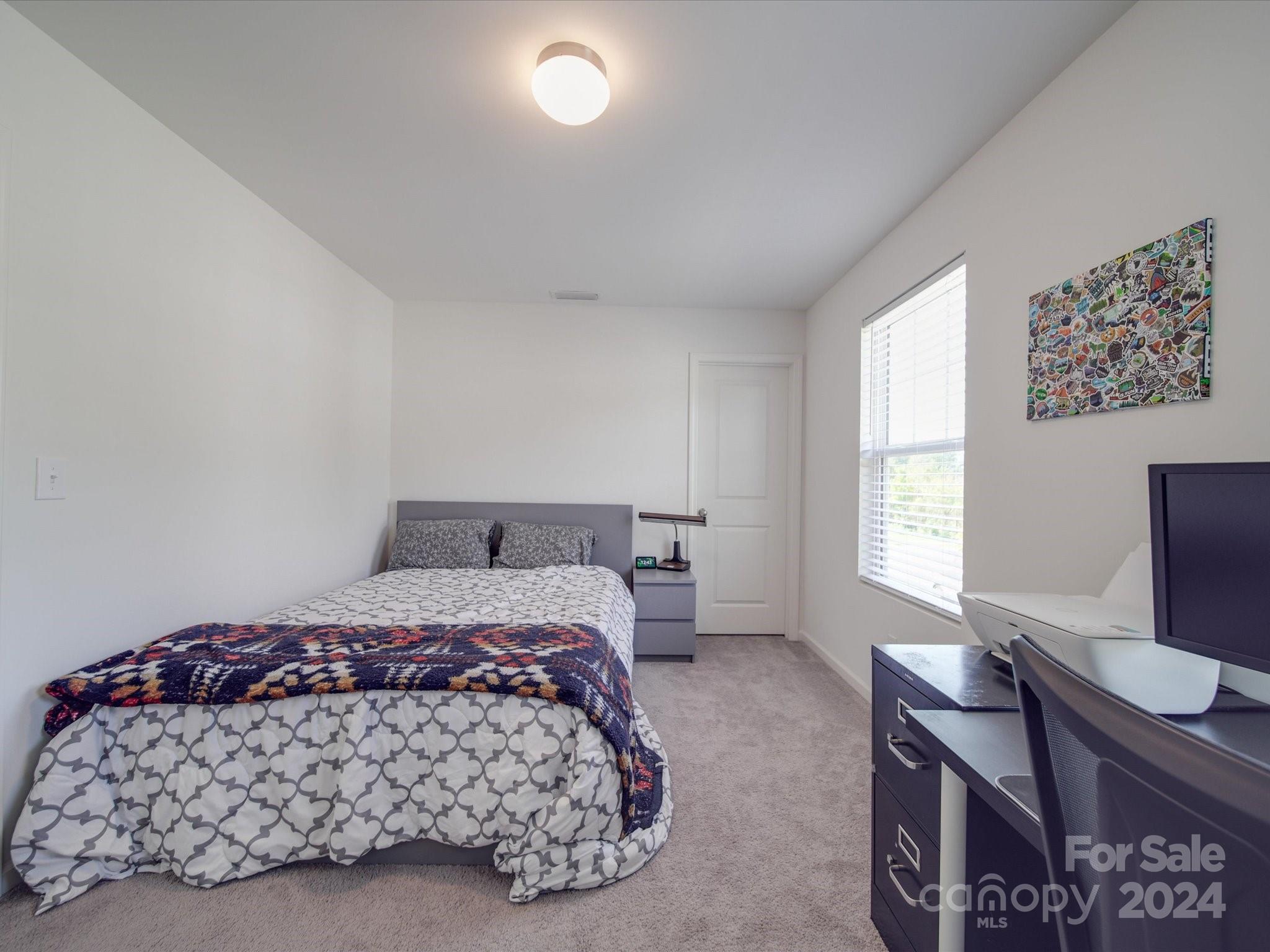3824 Tersk Drive Midland, NC 28107 - Photo 27 of 39 a bedroom with a bed and a window