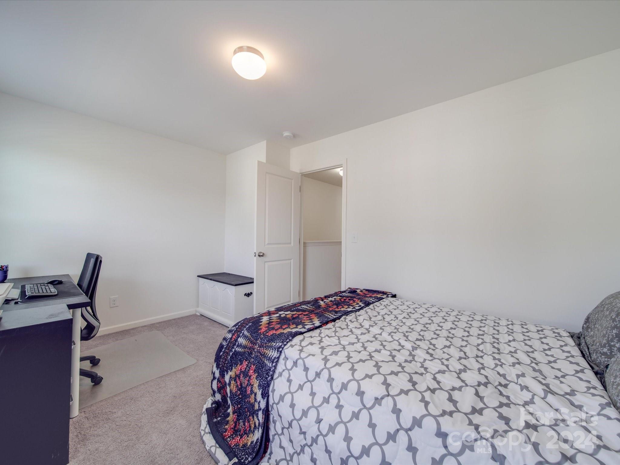 3824 Tersk Drive Midland, NC 28107 - Photo 29 of 39 a bedroom with a bed and chair