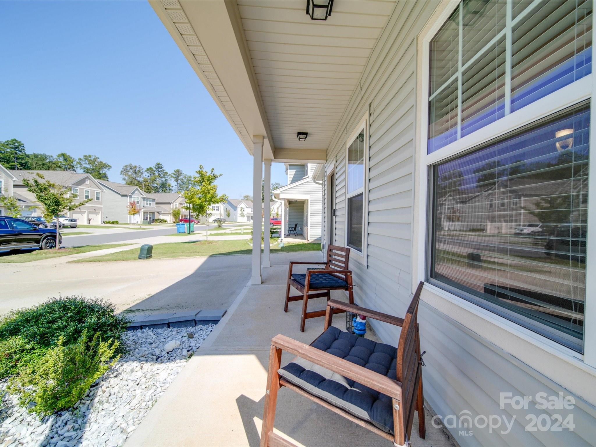 3824 Tersk Drive Midland, NC 28107 - Photo 32 of 39 a swimming pool with outdoor seating and yard