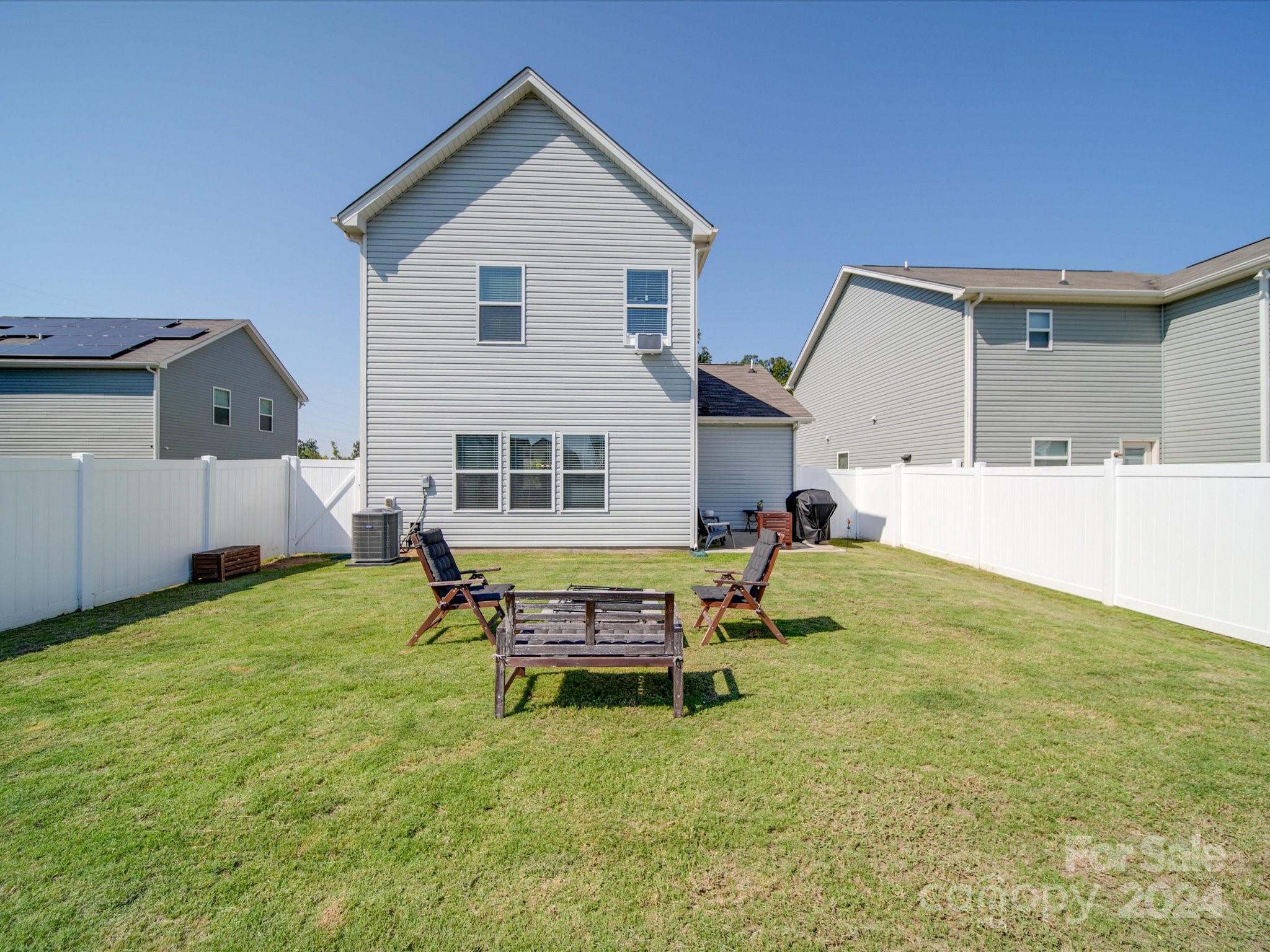 3824 Tersk Drive Midland, NC 28107 - Photo 35 of 39 a backyard of a house with table and chairs