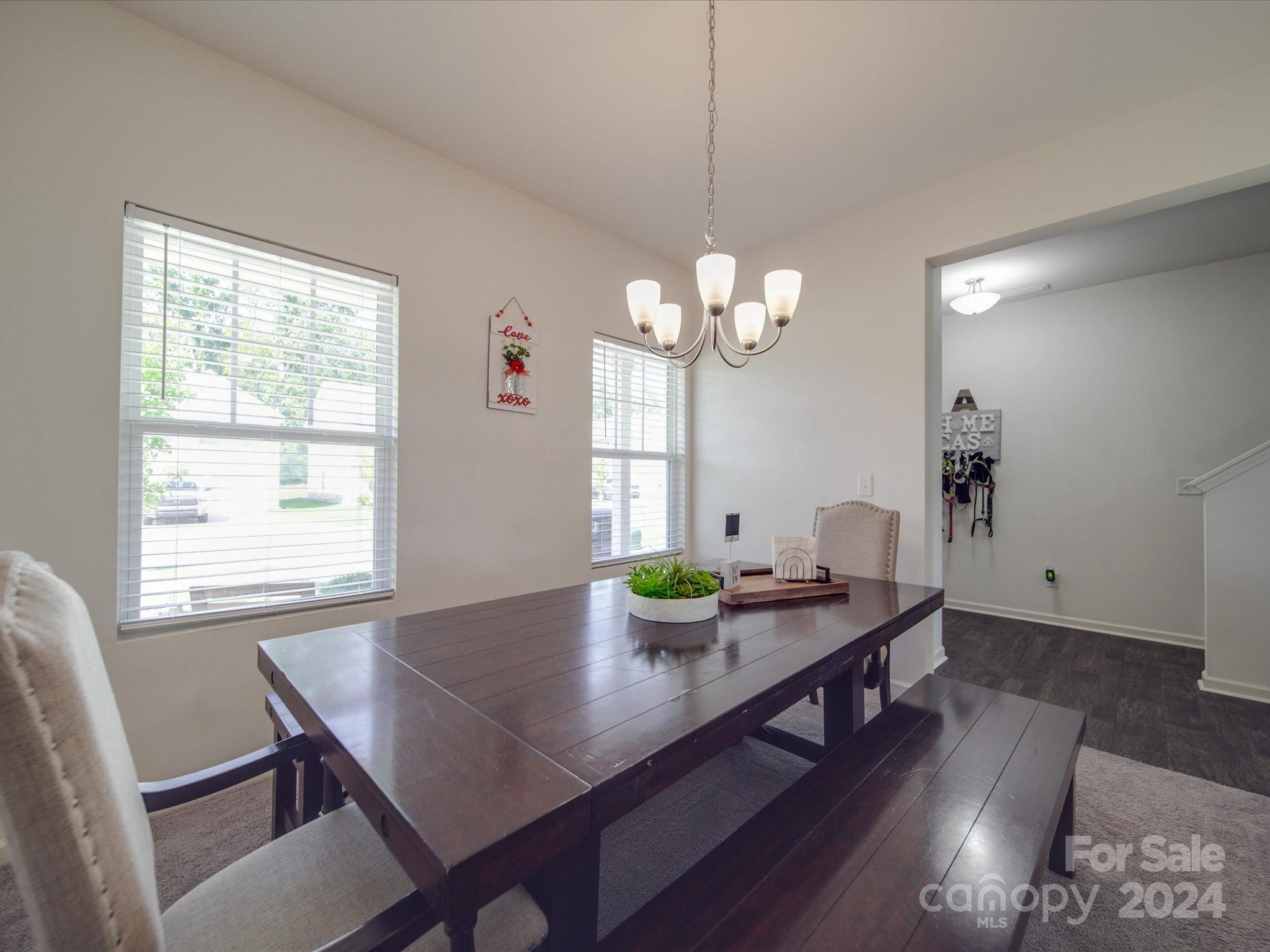 3824 Tersk Drive Midland, NC 28107 - Photo 4 of 39 a view of a dining room with furniture window and wooden floor
