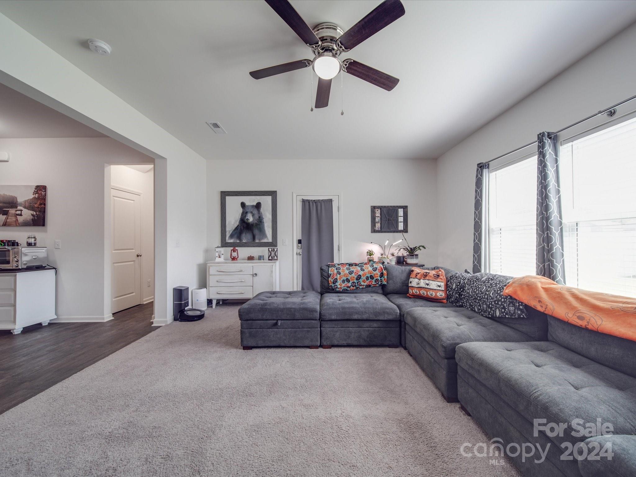 3824 Tersk Drive Midland, NC 28107 - Photo 9 of 39 a living room with furniture and a large window