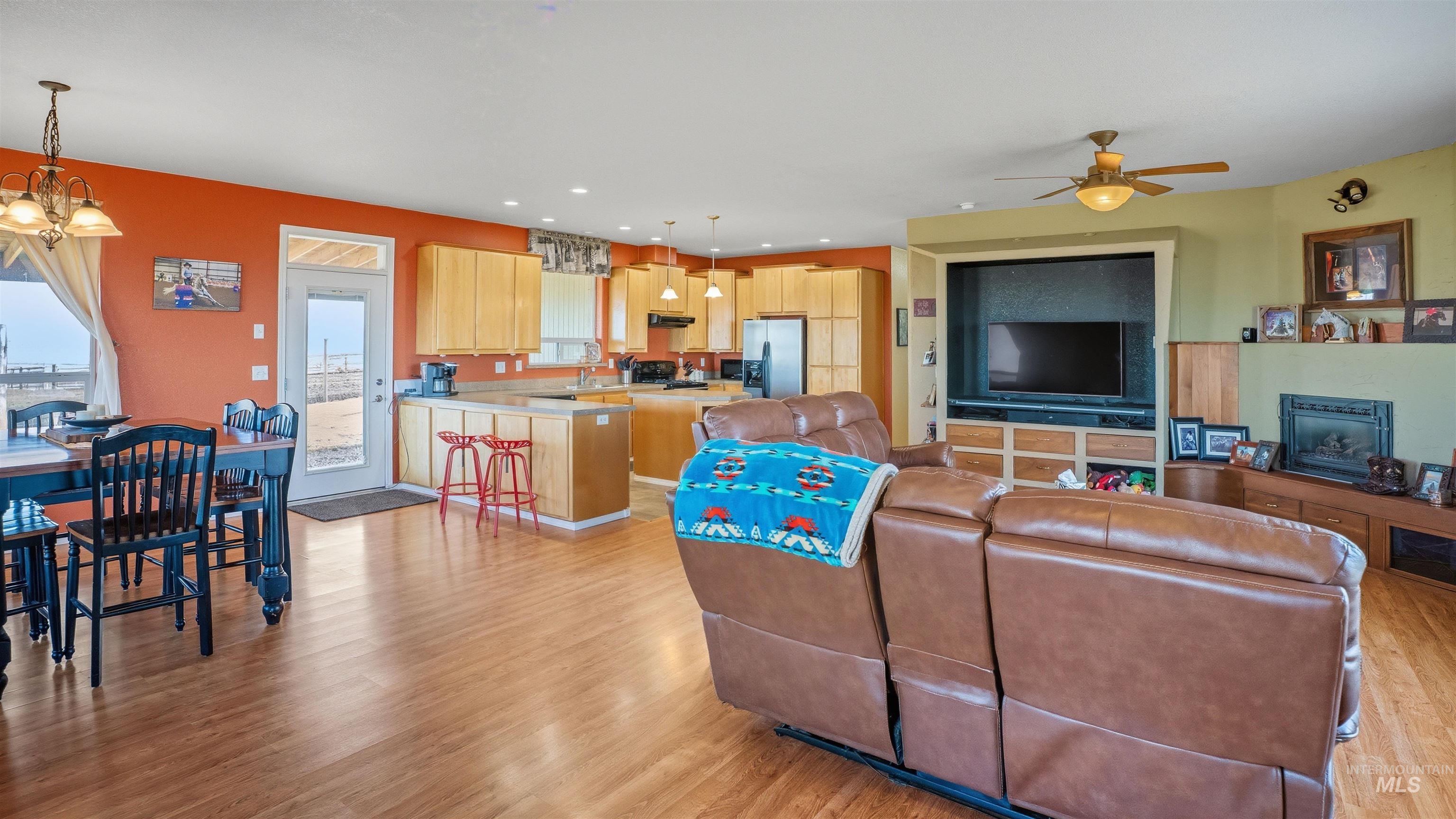 19397 Cloverland Road Asotin, WA 99402 - Photo 13 of 35 Living area with light wood-style flooring, hanging lights, and ceiling fan