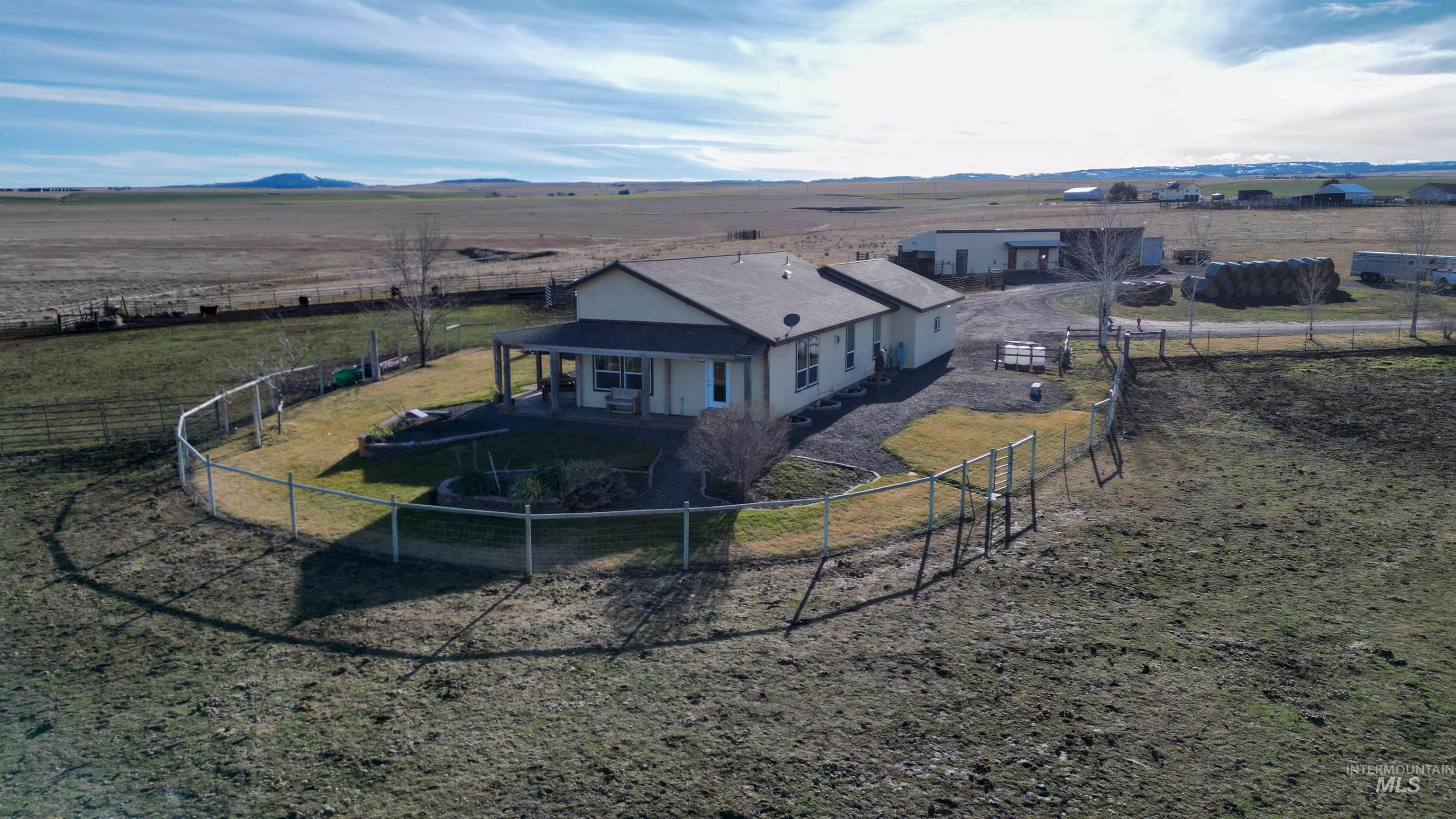 19397 Cloverland Road Asotin, WA 99402 - Photo 3 of 35 Rear view of property with a view of countryside, a fenced backyard, and a mountain view