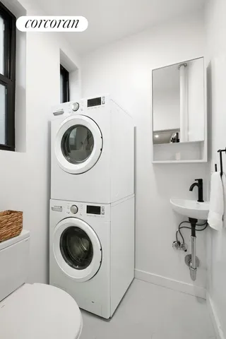 a spacious bedroom with a bed and glass door