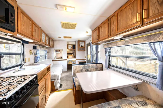a view of a swimming pool with a table and chairs