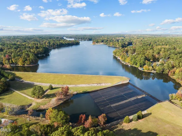 a view of a lake with a yard