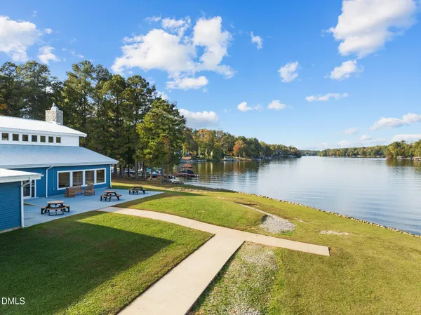 an aerial view of a houses with a lake view