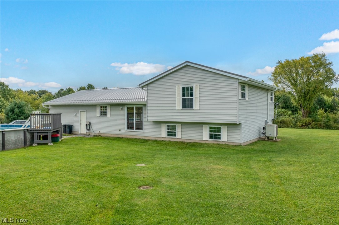 8045 State Rte 5 Ravenna, OH 44266 - Photo 5 of 32 Back of house with a lawn