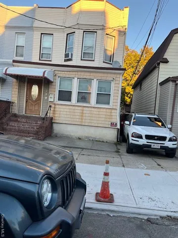a car parked in front of a house