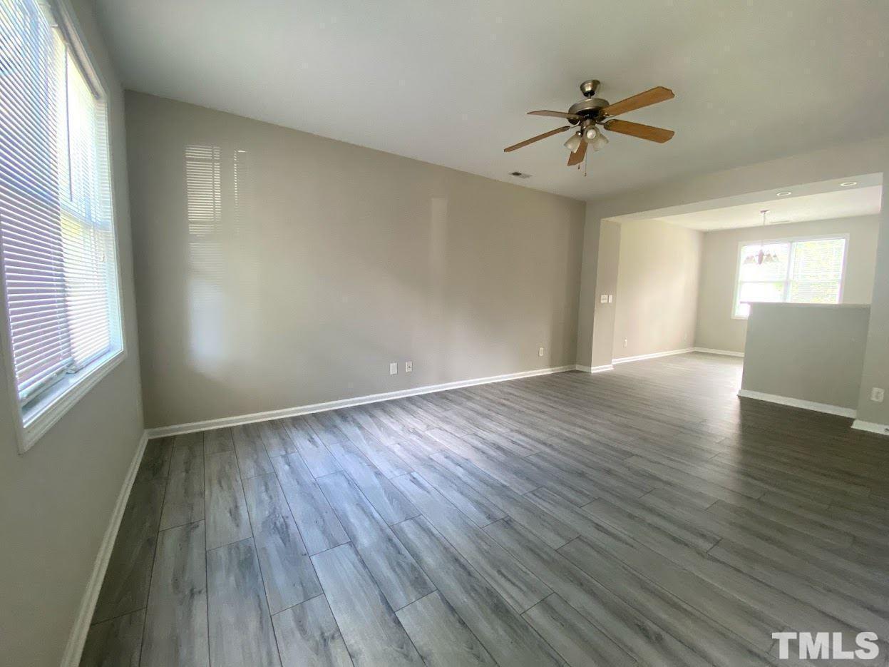 5105 Powell Townes Way Raleigh, NC 27606 - Photo 6 of 14 wooden floor in an empty room with a window