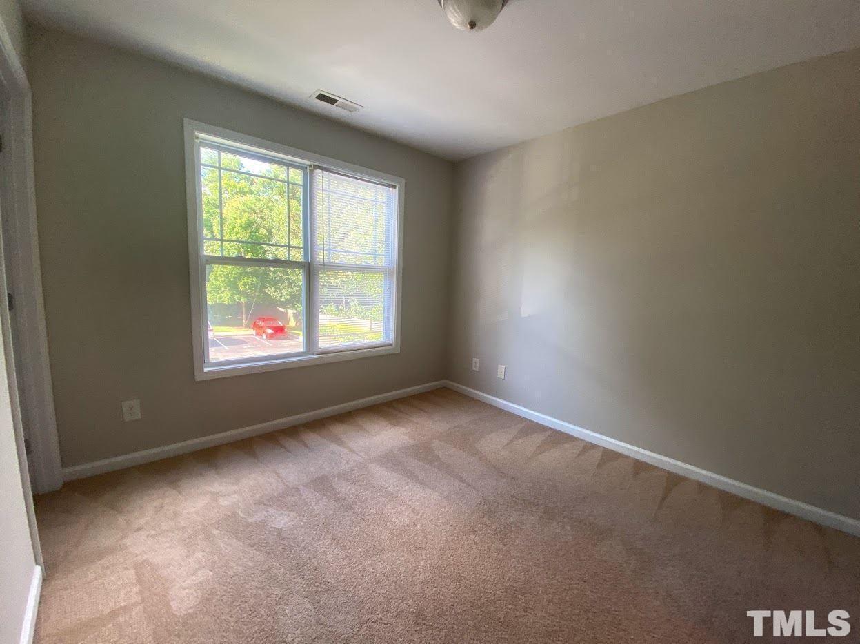 5105 Powell Townes Way Raleigh, NC 27606 - Photo 9 of 14 an empty room with windows