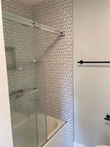 a bathroom with a shower and a bathtub