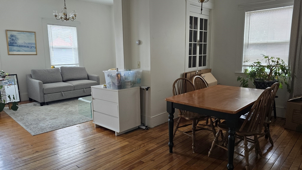 331 Plantation Street, Unit 1 Worcester, MA 01604 - Photo 4 of 15 a living room with furniture and wooden floor