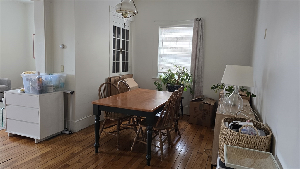 331 Plantation Street, Unit 1 Worcester, MA 01604 - Photo 5 of 15 a view of a workspace with furniture and wooden floor
