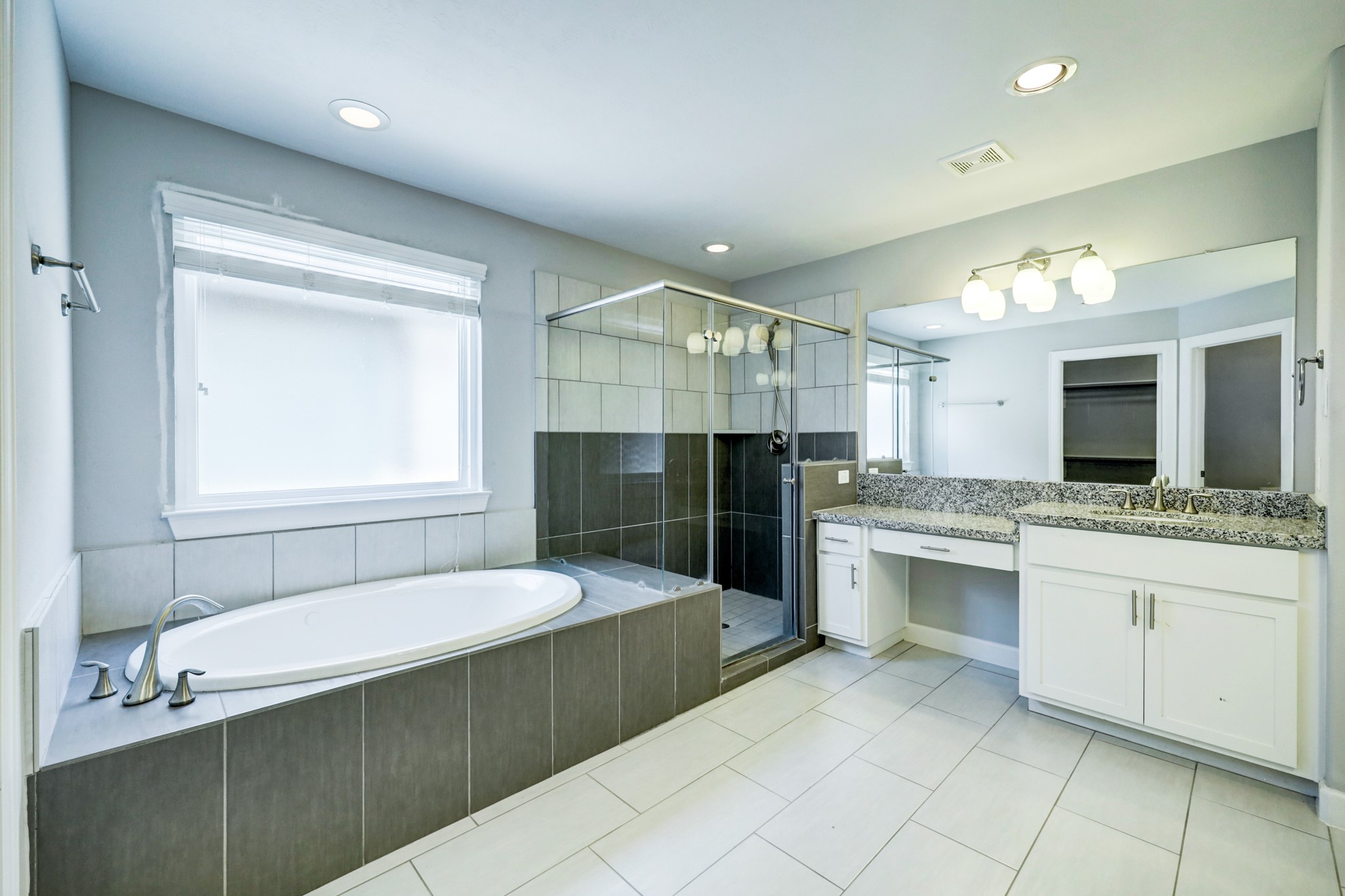 1811 Wichita Street, Unit A Houston, TX 77004 - Photo 4 of 29 a bathroom with a sink vanity and mirror